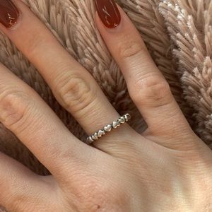 PANDORA Solid Band of Hearts Ring in Sterling Silver.